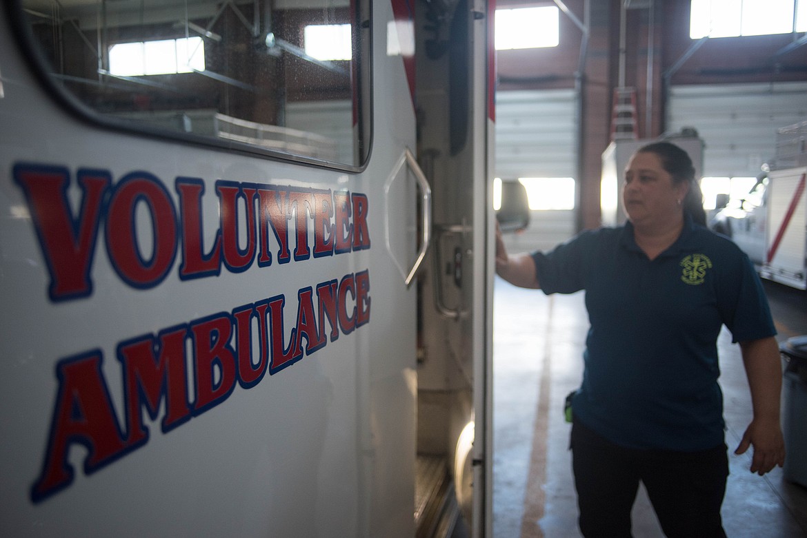 Amy Milde shuts an ambulance door, Monday at the Libby Volunteer Ambulance barn. &#147;When they call that ambulance, that&#146;s literally the worst day of their life,&#148; she said. It feels good to provide any level of comfort for those in need. (Luke Hollister/The Western News)