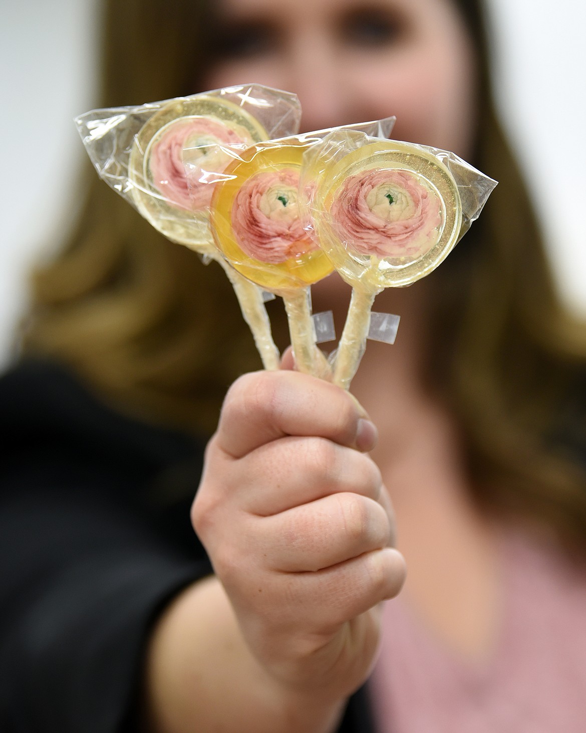 Stephanie Murray with some of the lollipops she made as owner of Fiddlestix Candy Co. in Evergreen.(Brenda Ahearn/Daily Inter Lake)