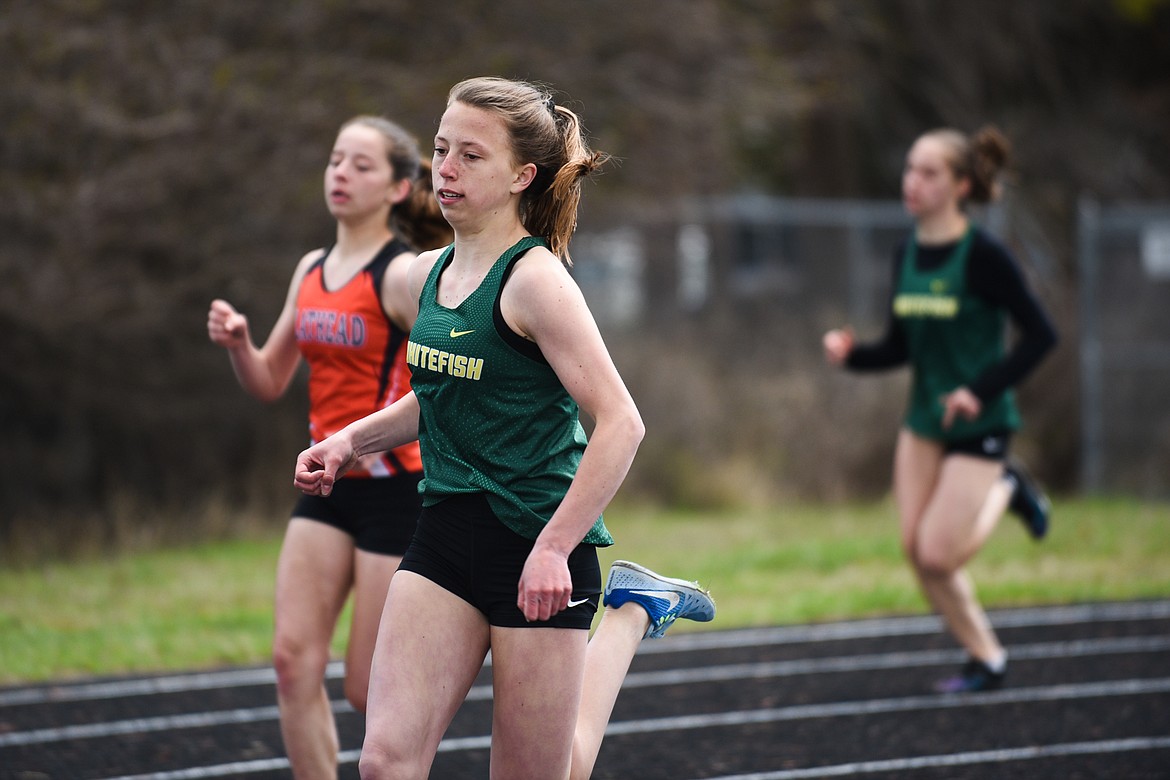 Whitefish&#146;s Mikenna Ells races in the 400 meter dash on a rainy A.R.M. Invitational Saturday at Whitefish.