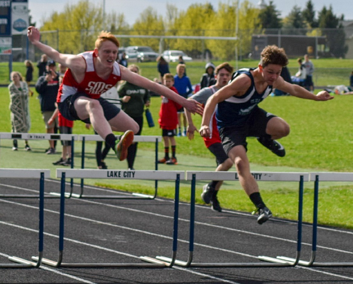 (Photo courtesy of CARLEEN SANDELL)
Eighth grader Rusty Lee (left) runs the 110 meter hurdles in Sandpoint Middle School&#146;s district meet on May 2.