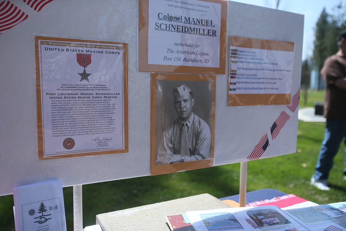 A display honoring Col. Manuel Schneidmiller shows a young war hero and details of his service and life. He was honored Saturday during the American Legion Post 154&#146;s 100th anniversary event in Evergreen Cemetery, where Schneidmiller is interred. 
(DEVIN WEEKS/Press)