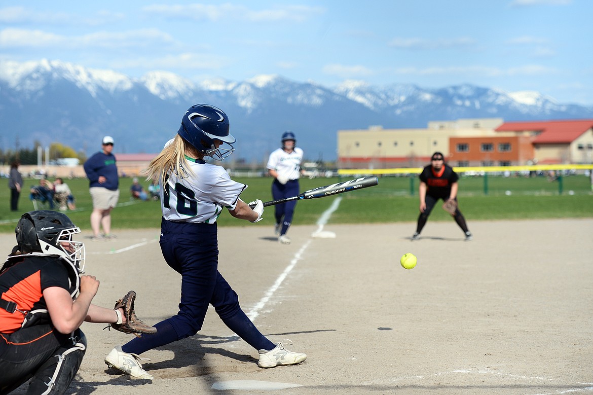 Glacier's Addie Labrum rips an RBI single in the bottom of the third against Flathead at Glacier High School on Thursday. (Casey Kreider/Daily Inter Lake)
