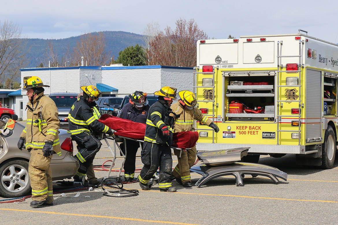 Photo by MANDI BATEMAN
Removing the fatality victim during the mock crash.