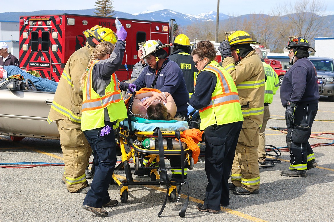 Photo by MANDI BATEMAN
Students played the roles of the victims during the distracted driving simulation.