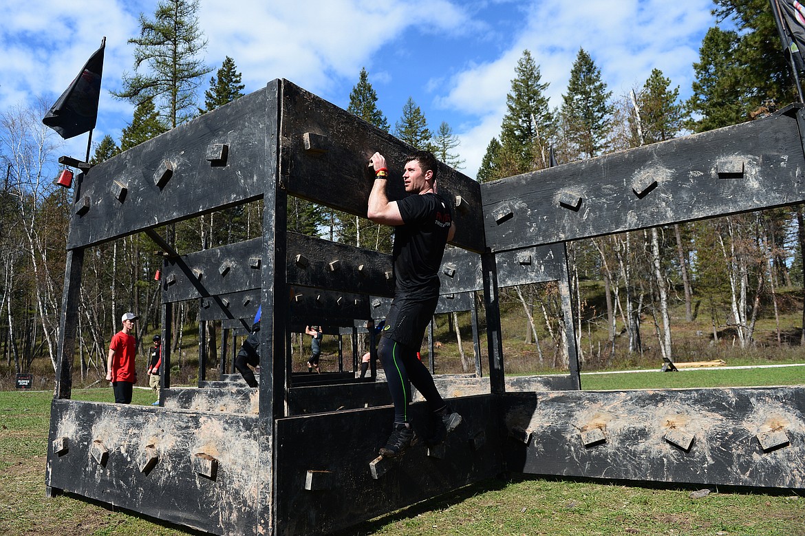 A competitor navigates a Z-Wall during the 13-mile Spartan Beast race at Flathead Lake Lodge in Bigfork on Saturday. (Casey Kreider/Daily Inter Lake)