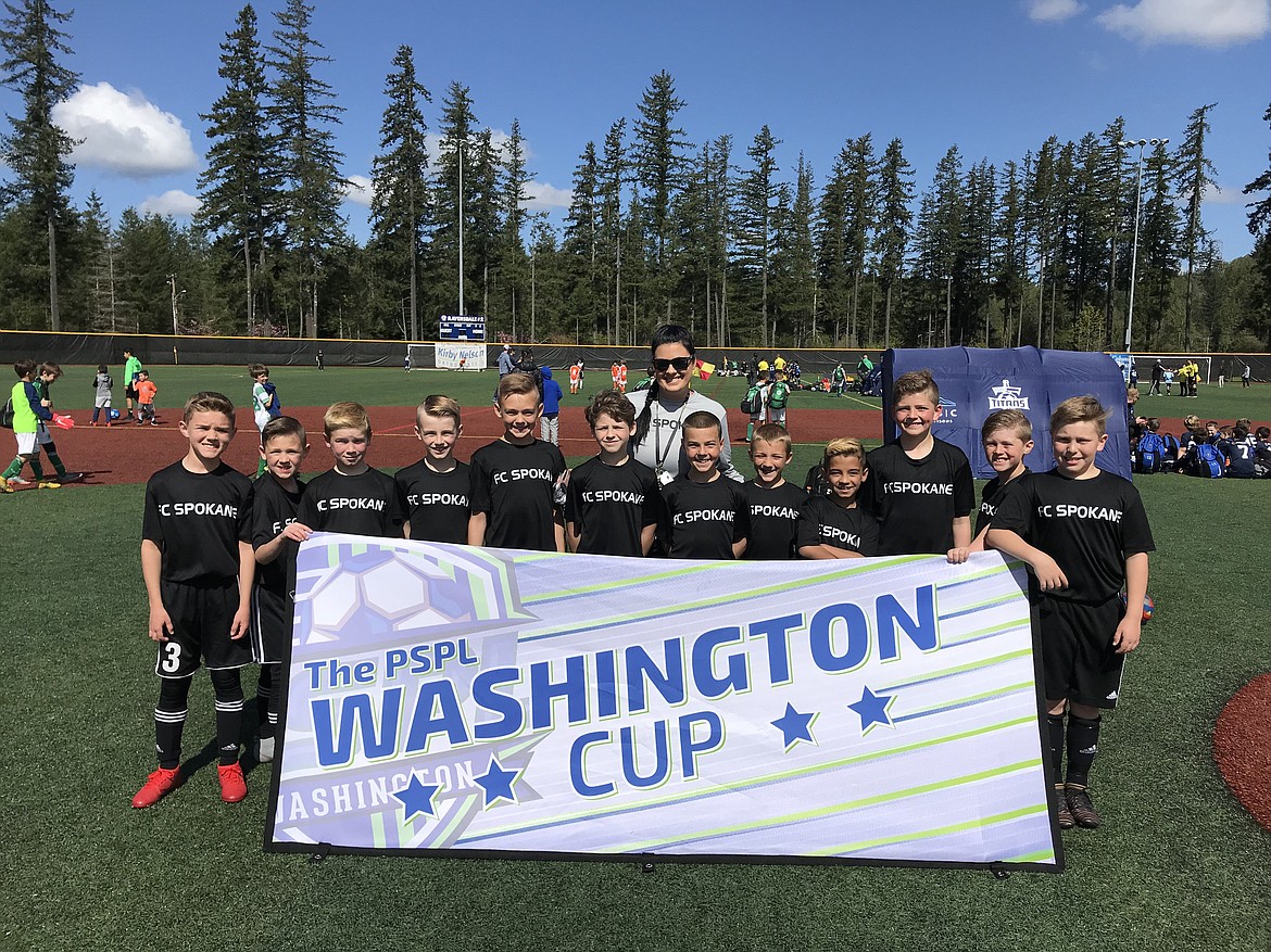 Courtesy photo
North Idaho FC Spokane soccer coach Ashley Rider took an &#146;09 FC group to the PSPL Washington Cup last weekend in Ravensdale, Wash. FC Spokane finished second in its bracket with a 2-1 record. From left are Tracen Crossley, Reid Thompson, Kash Burger-McLuskie, Marty Babb, Henry Weimer-Earnest, Connor Karlin, coach Ashley Rider, Braden Smith, Ryan Mercer, Brycen Quinones, Elijah Rigsby, Liam Mortensen and Cyrus Cone.