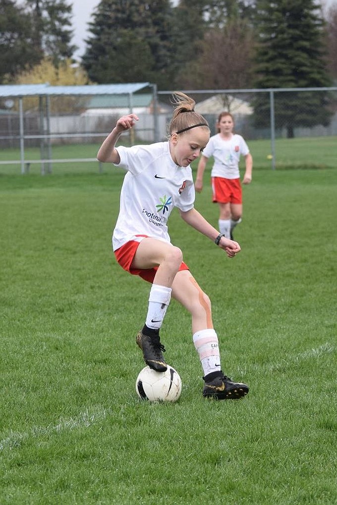 Courtesy photo
Lily Bole of the Thorns Girls &#146;07 Red soccer team player saves the ball at the line and keeps possession in the Thorns&#146; 4-0 win over the EW Surf SC 07 White North on April 20. Natalie Thompson had one goal, Evelyn Bowie had a long shot from the 18, and Rachel Corette scored twice for the Thorns. On April 22, in a nonleague scrimmage against the Sandpoint Strikers G07, the Thorns won 1-0, with the lone goal scored by Rachel Corette.