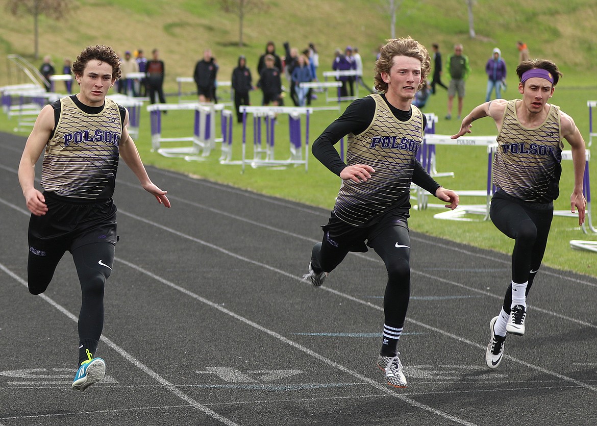 POLSON HIGH School runner Dugan Davis, along with teamates Parker Toth, Alex Wall-Wilbert all competed with each other in the 100-meter dash. Davis won the dash, recording a time of 11.72 Thursday afternoon at Polson High School. (Photo courtesy of Bob Gunderson)