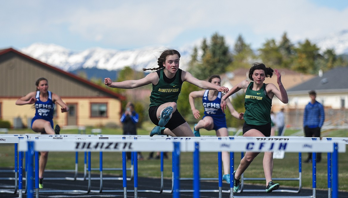 Natasha Abramchuk races to the front of the pack in the 100 hurdles at Columbia Falls last Tuesday. (Daniel McKay/Whitefish Pilot)