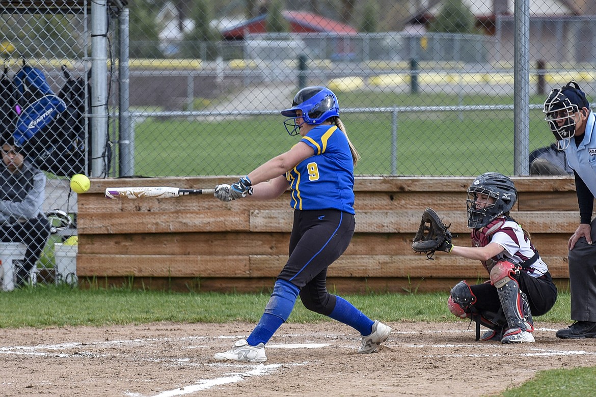 Libby senior Emily Carvey gets a base hit with a ground ball to left field, top of the fourth inning, during the Libby-Troy varsity game at Troy, April 30. (Ben Kibbey/The Western News)