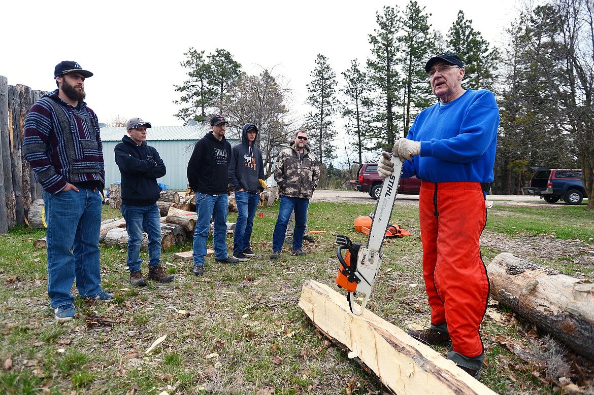 Sawyer class instructor Paul Uken speaks to the group about maintaining a chainsaw&#146;s bar and chain at the FVCC Logger Sports Arena at Flathead Valley Community College on Friday, April 26. (Casey Kreider/Daily Inter Lake)