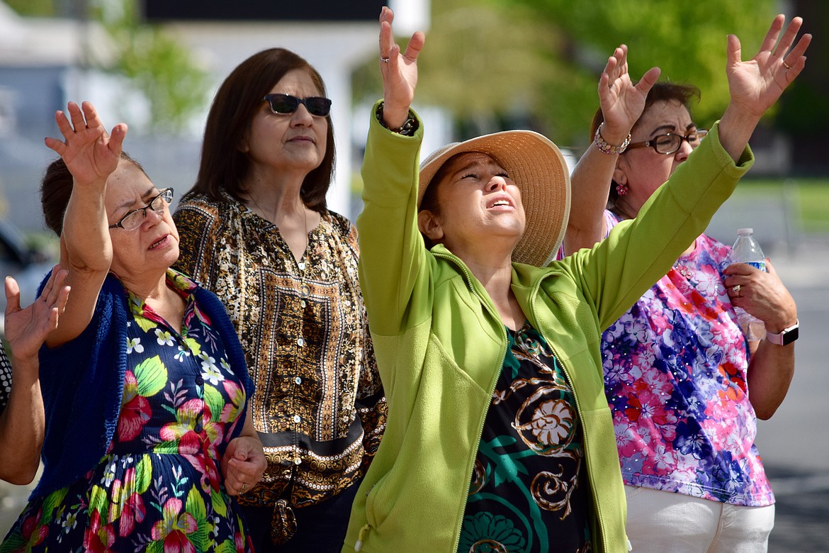 Charles H. Featherstone/The Sun Tribune
Worshipers pray in front of Othello City Hall during the National Day of Prayer service last Thursday.