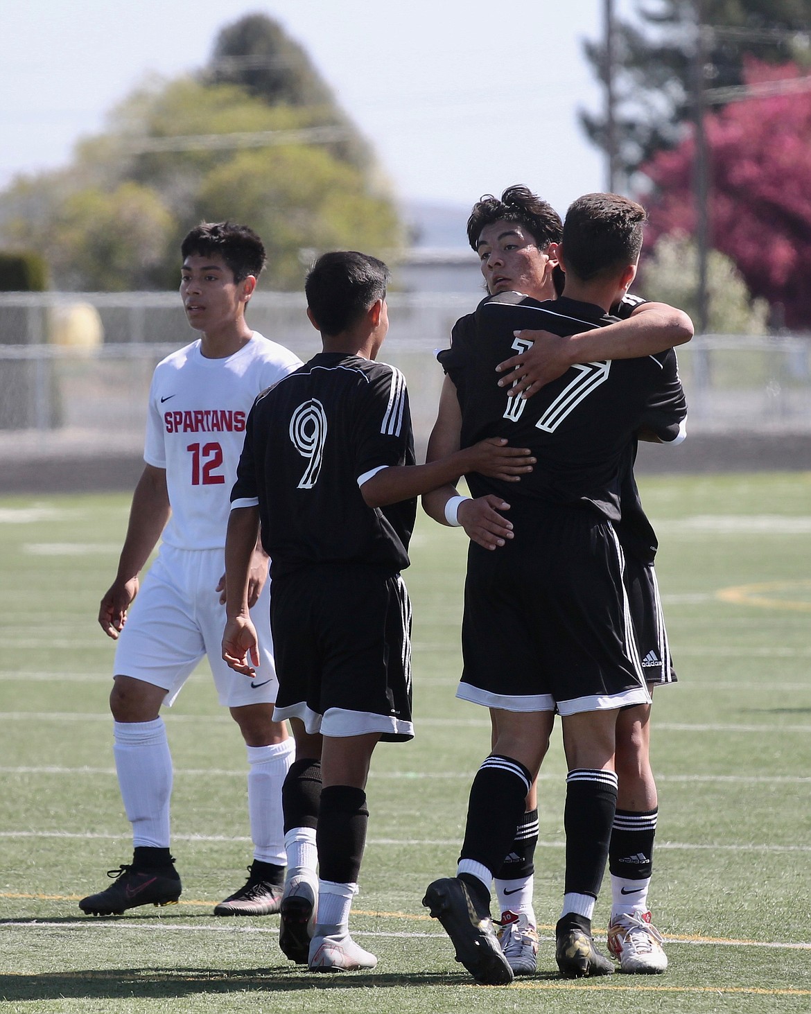 Casey McCarthy/Sun Tribune
Royal sophomore Eliseo Romero celebrates with teammates Luis Rodriguez and Lizandro Hernandez after scoring in the first half against Granger. The Knights won the game 6-0 on Saturday at home.