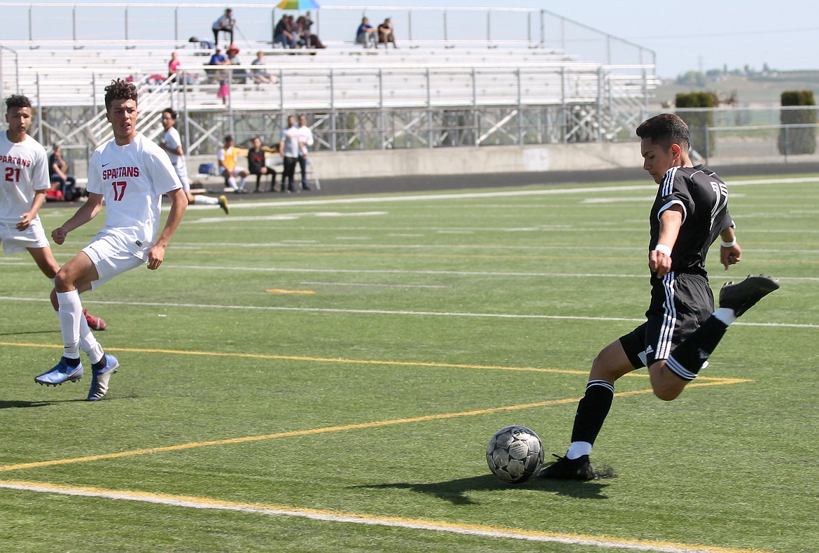 Casey McCarthy/Sun Tribune
 Royal sophomore Eliseo Romero fires a shot against Granger in the Knights&#146; 6-0 victory in the first round of the District 5 Tournament on Saturday.