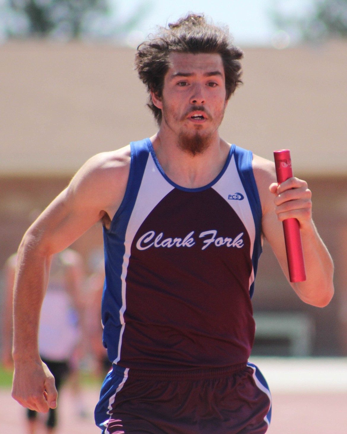 JESSE SHASKE runs in the 4x100 relay at the Kim Haines Invitational in Missoula. Clark Fork placed eighth in the event with a time of 47:92. (Maggie Dresser/Mineral Independent)