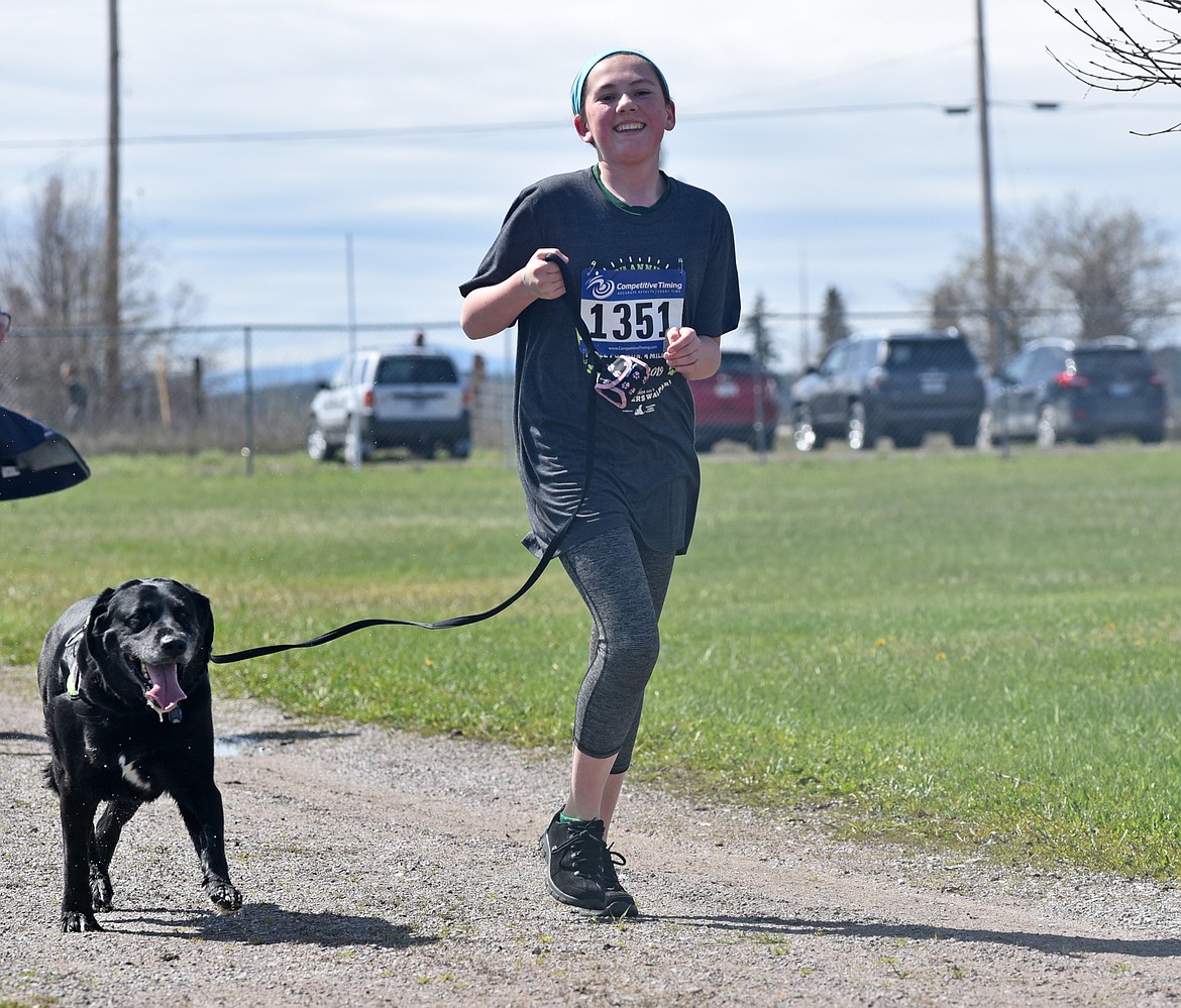 Runners and their dogs participated in the WAG Race Sunday morning beginning and ending at the WAG dog park. The race is annual fundraiser for the park.  (Heidi Desch/Whitefish Pilot)