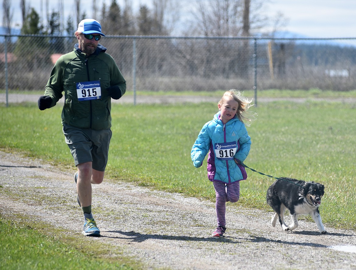 Runners and their dogs participated in the WAG Race Sunday morning beginning and ending at the WAG dog park. The race is annual fundraiser for the park.  (Heidi Desch/Whitefish Pilot)