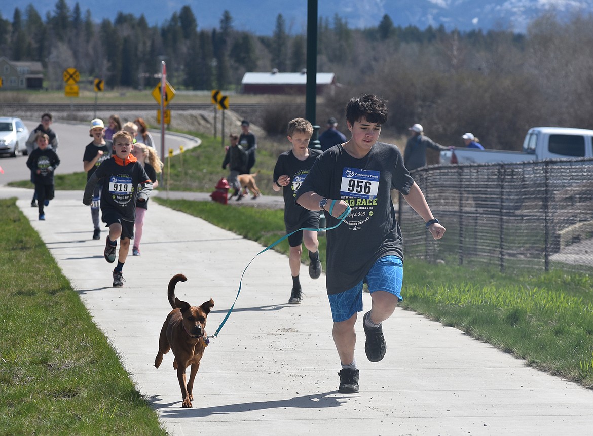 Runners and their dogs participated in the WAG Race Sunday morning beginning and ending at the WAG dog park. The race is annual fundraiser for the park.  (Heidi Desch/Whitefish Pilot)