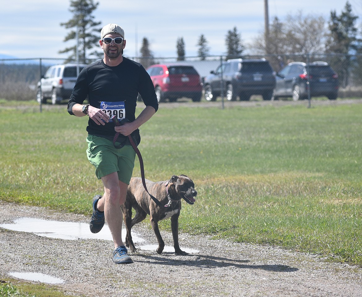 Runners and their dogs participated in the WAG Race Sunday morning beginning and ending at the WAG dog park. The race is annual fundraiser for the park.  (Heidi Desch/Whitefish Pilot)