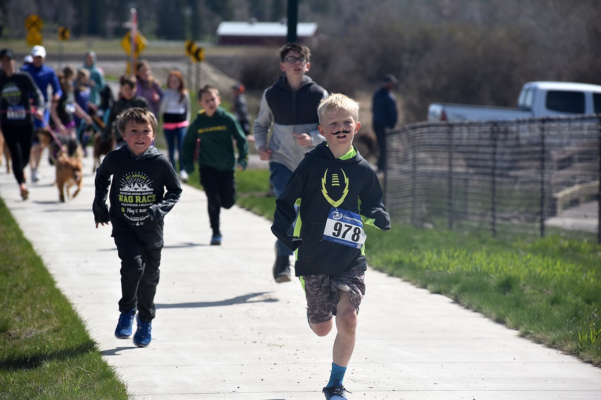 Runners and their dogs participated in the WAG Race Sunday morning beginning and ending at the WAG dog park. The race is annual fundraiser for the park.  (Heidi Desch/Whitefish Pilot)