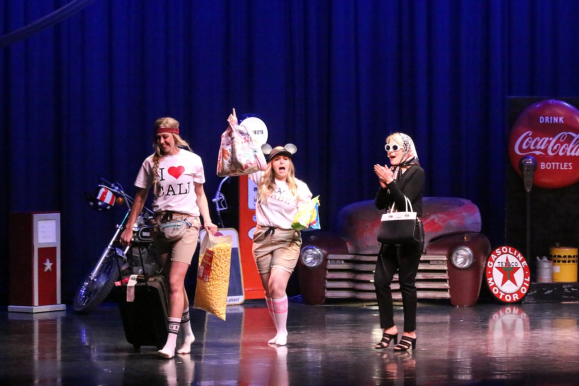 Photo by MANDI BATEMAN
Ashley Guttin, Jerzie Pluid, and Kris Crocker on the stage at the beginning of the show, playing the part of a family embarking on a road trip down Route 66.