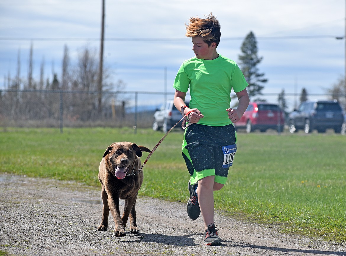 Runners and their dogs participated in the WAG Race Sunday morning beginning and ending at the WAG dog park. The race is annual fundraiser for the park.  (Heidi Desch/Whitefish Pilot)