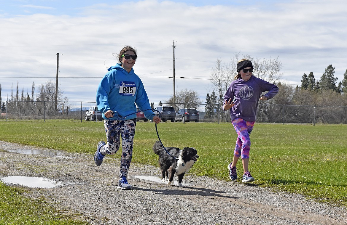 Runners and their dogs participated in the WAG Race Sunday morning beginning and ending at the WAG dog park. The race is annual fundraiser for the park.  (Heidi Desch/Whitefish Pilot)