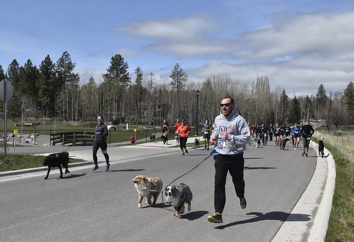 Runners and their dogs participated in the WAG Race Sunday morning beginning and ending at the WAG dog park. The race is annual fundraiser for the park.  (Heidi Desch/Whitefish Pilot)