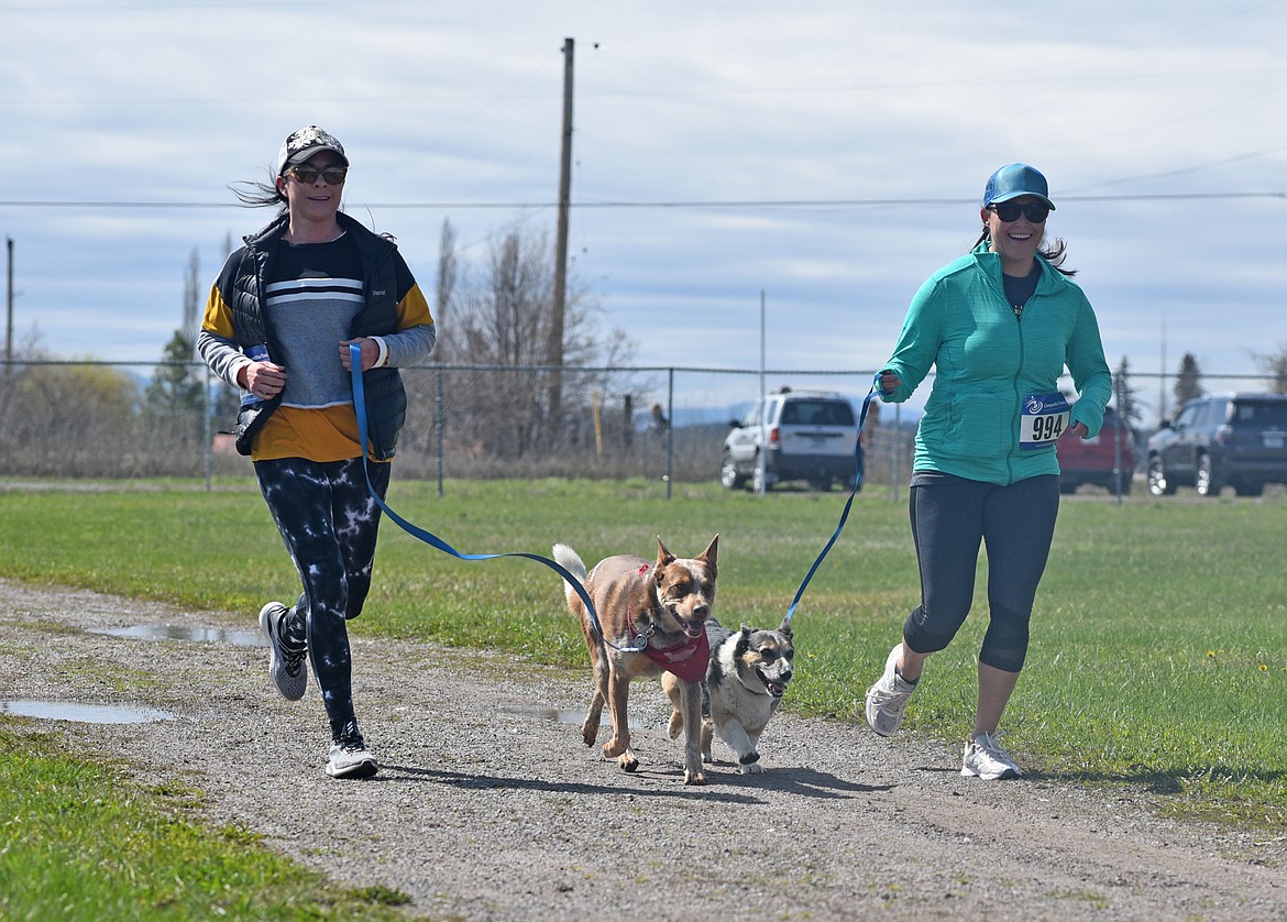 Runners and their dogs participated in the WAG Race Sunday morning beginning and ending at the WAG dog park. The race is annual fundraiser for the park.  (Heidi Desch/Whitefish Pilot)