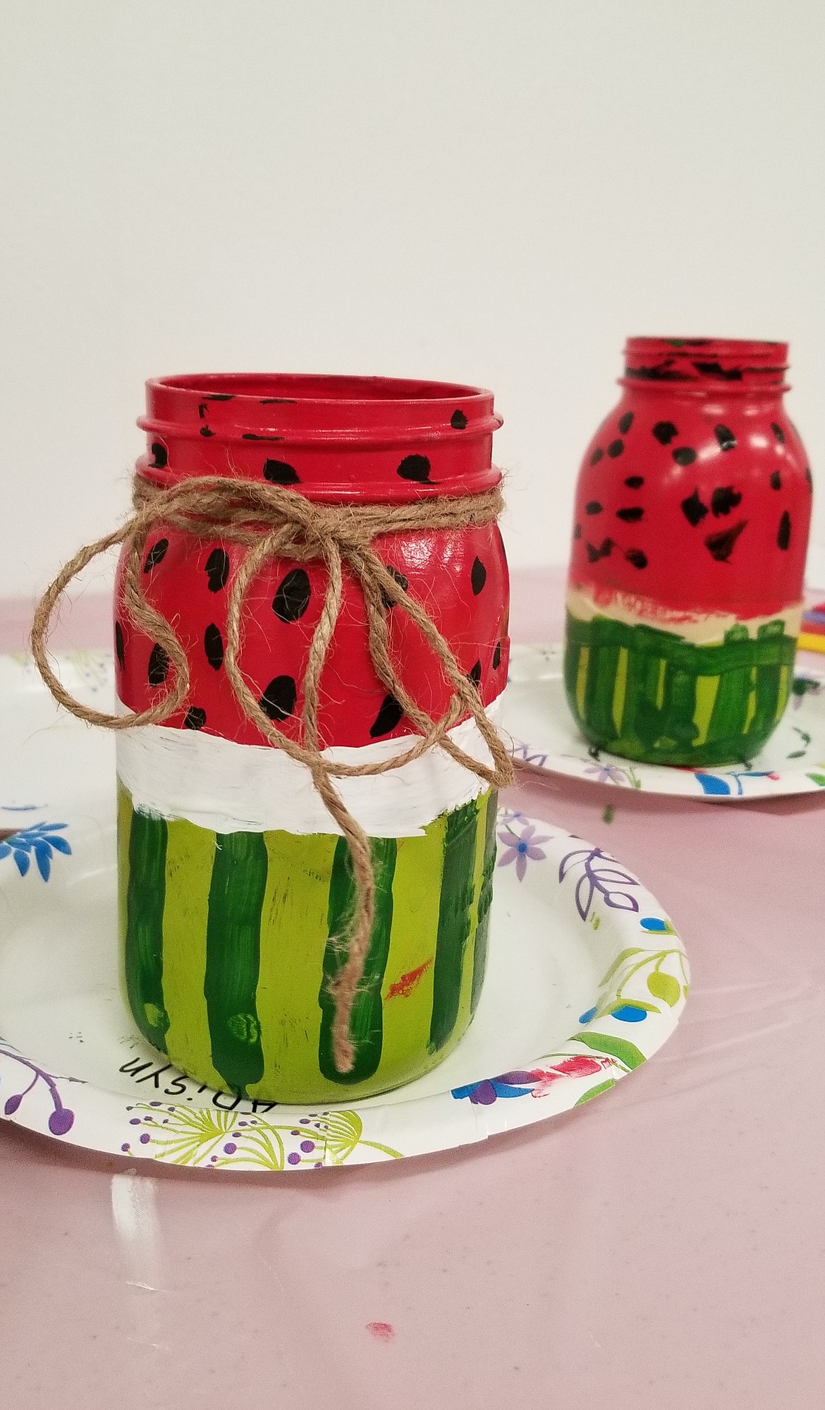 Watermelon Utensil Jars drying after being hand painted during the CREATE event.