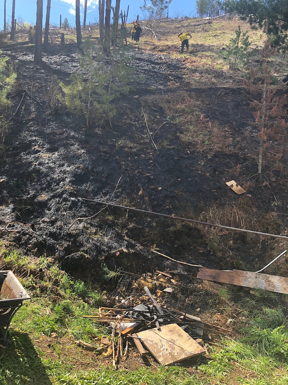 Photo by Josh McDonald/ This is the burn pile where the fire began on Upper Third Street.