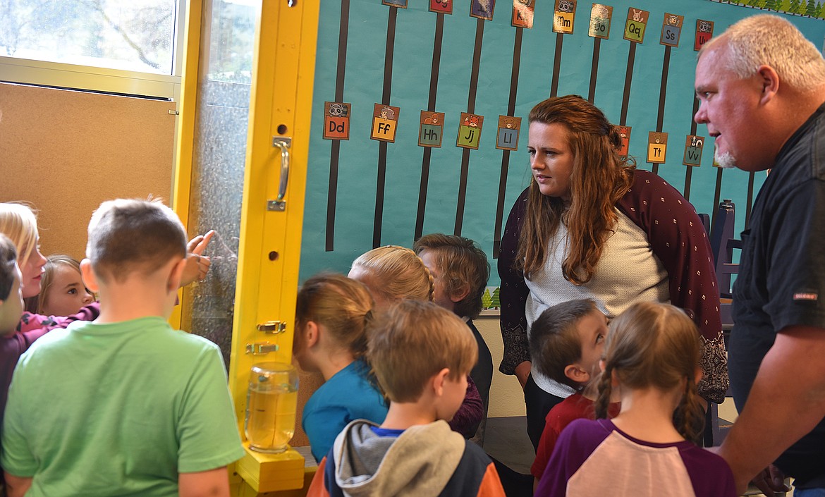 PLAINS KINDERGARTEN teacher Katie Hillerman andstudents are fascinated by the honeybee activities as the students.