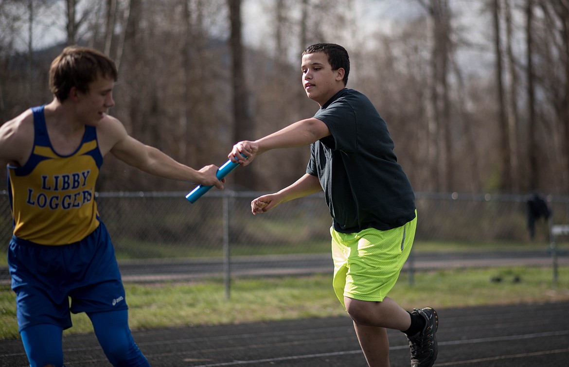 Jerry Powell races to pass the baton during a unified race, Tuesday at the Lincoln County Track Meet in Libby. &quot;Believe you can do it,&quot; he said. (Luke Hollister/The Western News)