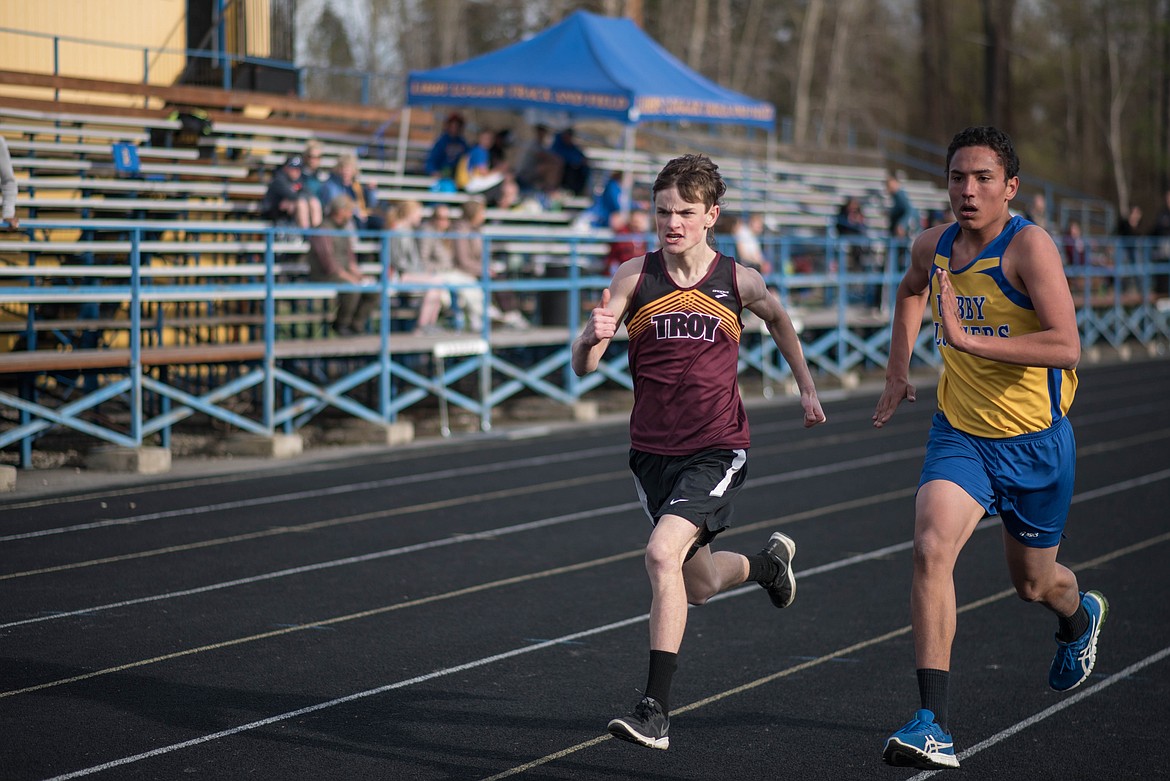 Ricky Starks and and Elijah Smith face off on the last leg of their 800 meter race, Tuesday at the Lincoln County Track Meet in Libby. (Luke Hollister/The Western News)