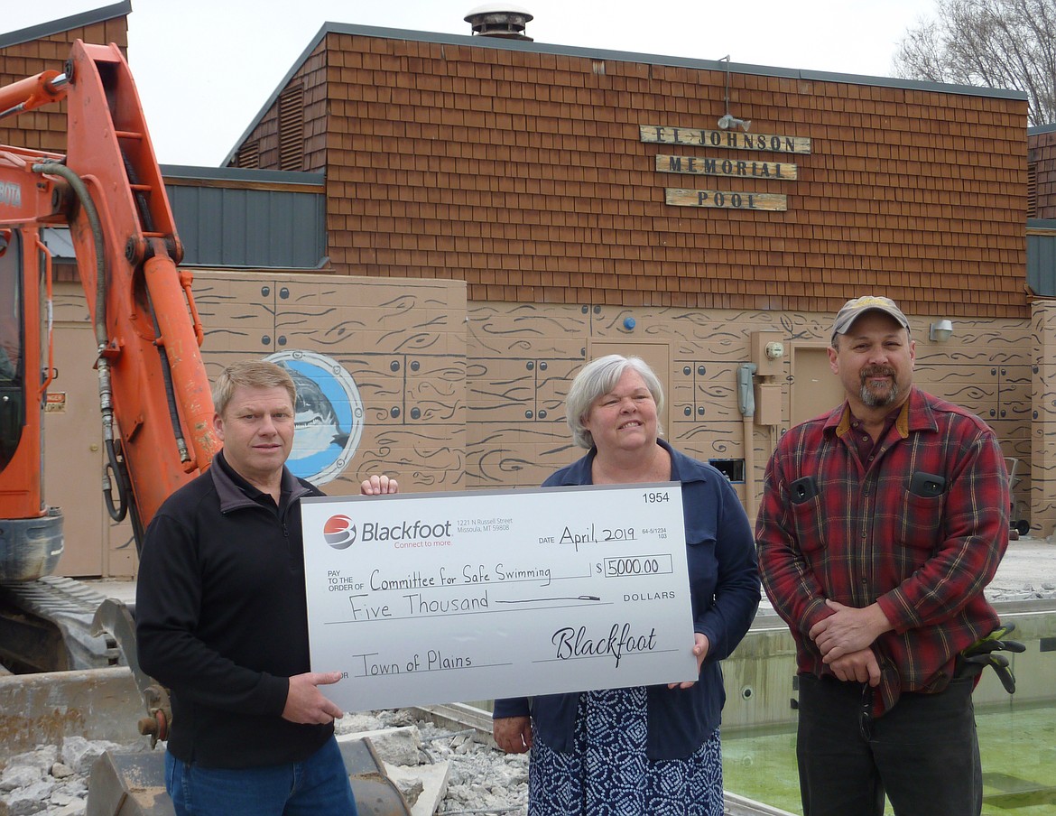 BLACKFOOT TELECOMMUNICATIONS made a $5,000 donation to Committee for Safe Swimming last week to go toward needed repairs at the E.L. Johnson Memorial Pool in Plains. Pictured, from left, are Jim Willoughby of Blackfoot; Janice Hanson of the committee; and Plains Mayor Dan Rowan. (Photo courtesy of Kathy Gregg)