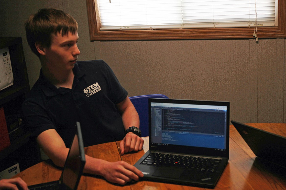 (CRAIG NORTHRUP/Press)
Hayden Carroll displays his coding prowess. The North Idaho STEM Charter School student developed his own advanced calculator app. Coding skills are in high demand among employers in the cybersecurity industry.