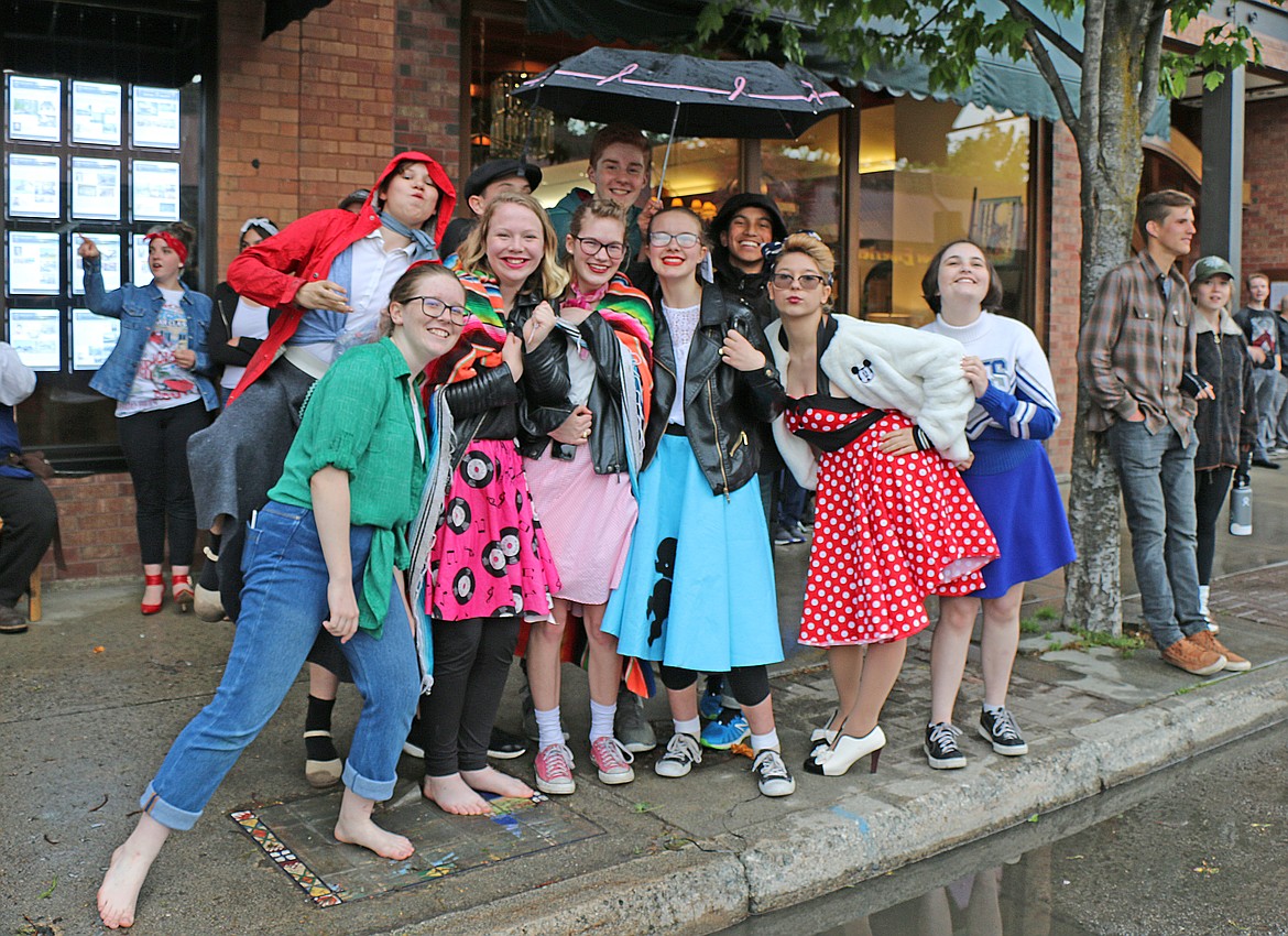 (Photo by CAROLINE LOBSINGER)Youngsters pose for the camera as they watch Friday's Lost in the &#146;50s parade from spot on First Avenue.