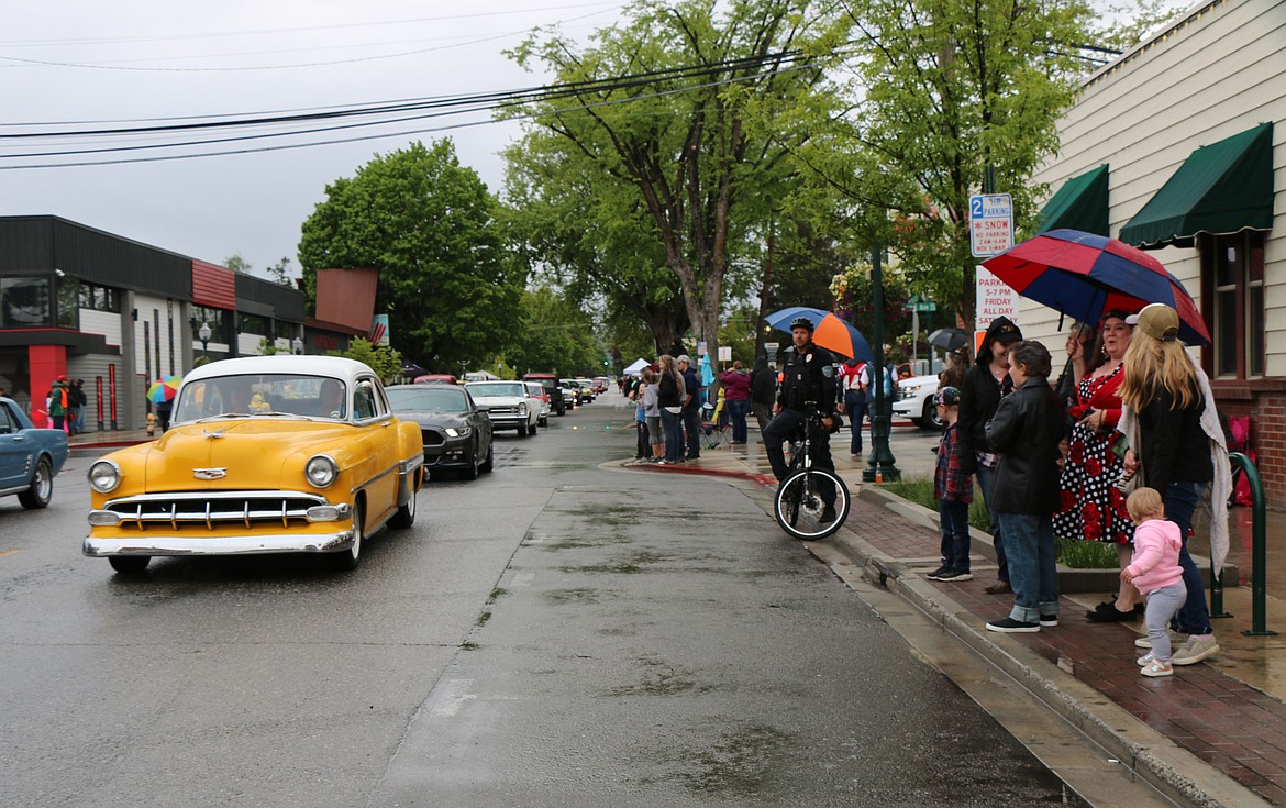 (Photo by CAROLINE LOBSINGER)Classic cars make their way down Church Street during Friday's Lost in the &#146;50s parade.