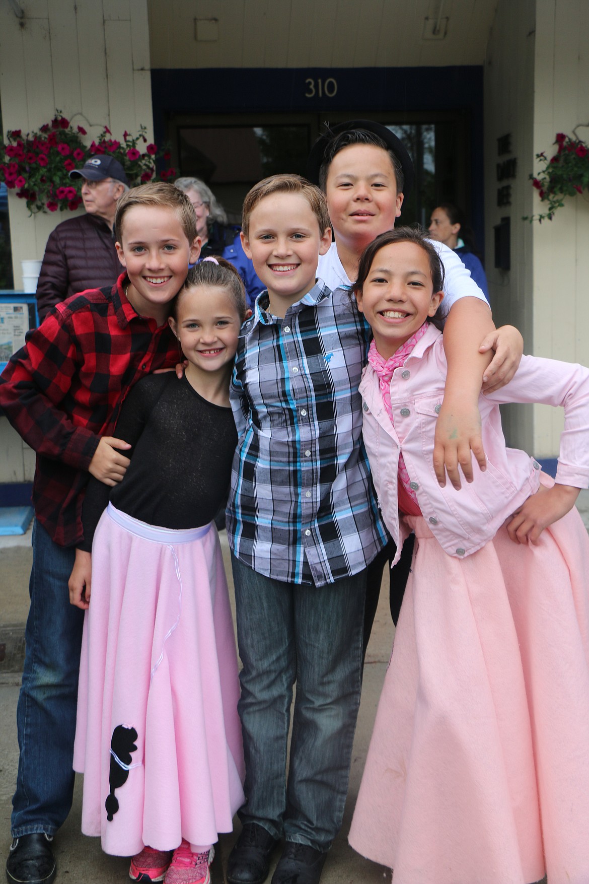 (Photo by CAROLINE LOBSINGER)Youngsters get into the spirit of the weekend as pose for the camera during Friday's Lost in the &#146;50s parade.