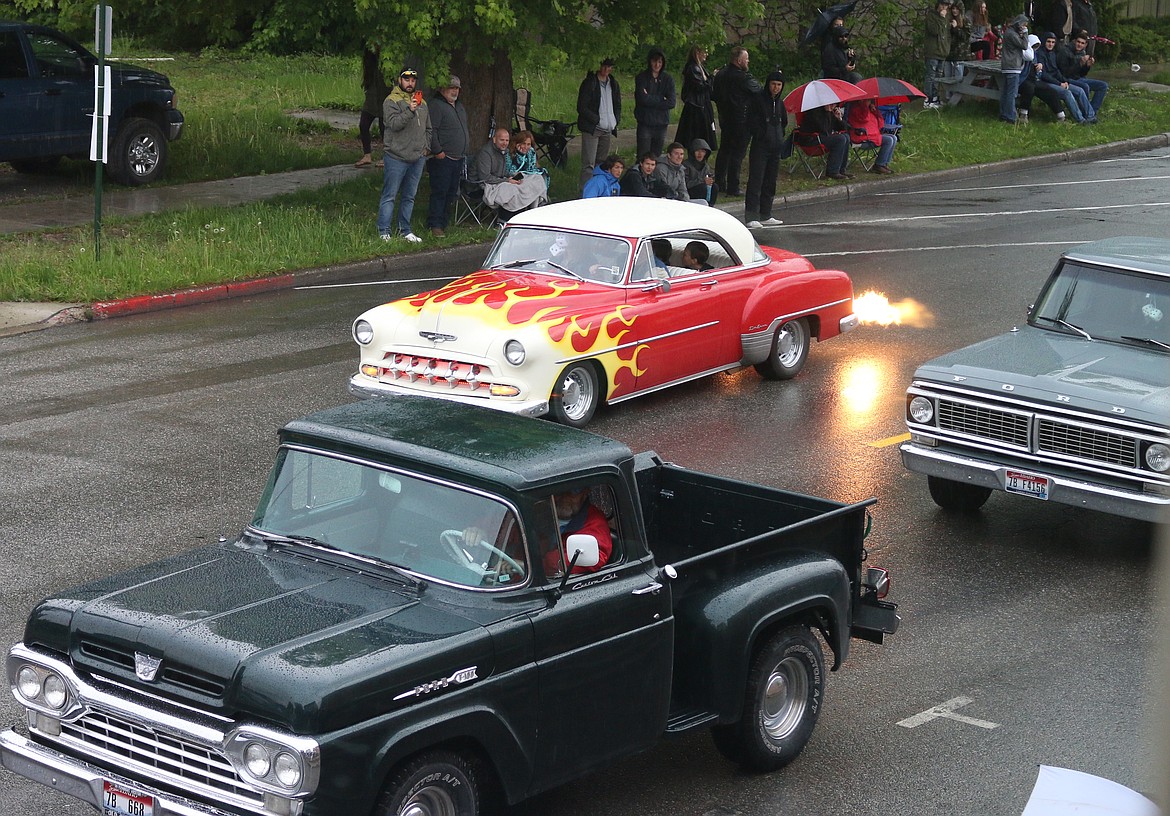 (Photo by MARY MALONE)
A driver entertains the crowd with a burnout &#151; causing flames to shoot out from the back of his classic car during Friday&#146;s Lost in the &#145;50s parade.