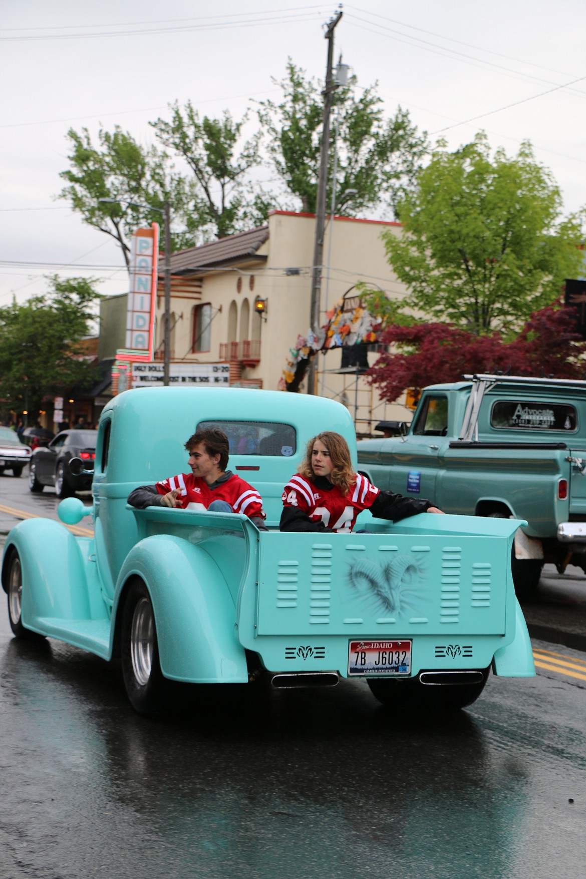 (Photo by CAROLINE LOBSINGER)A pair of Sandpoint High School football players catch a ride during Friday's Lost in the &#146;50s parade.