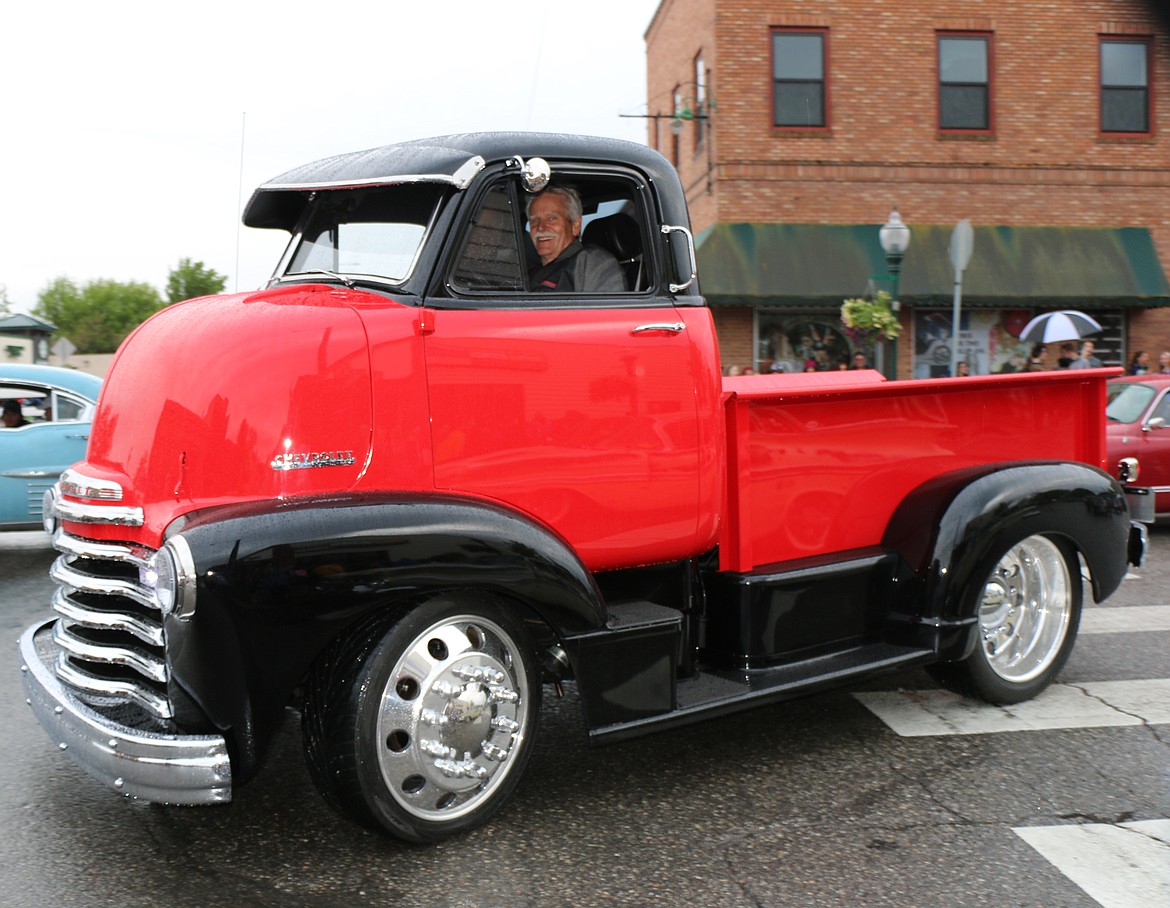 (Photo by CAROLINE LOBSINGER)Smiles abounded despite a rainy Lost in the &#146;50s parade on Friday.