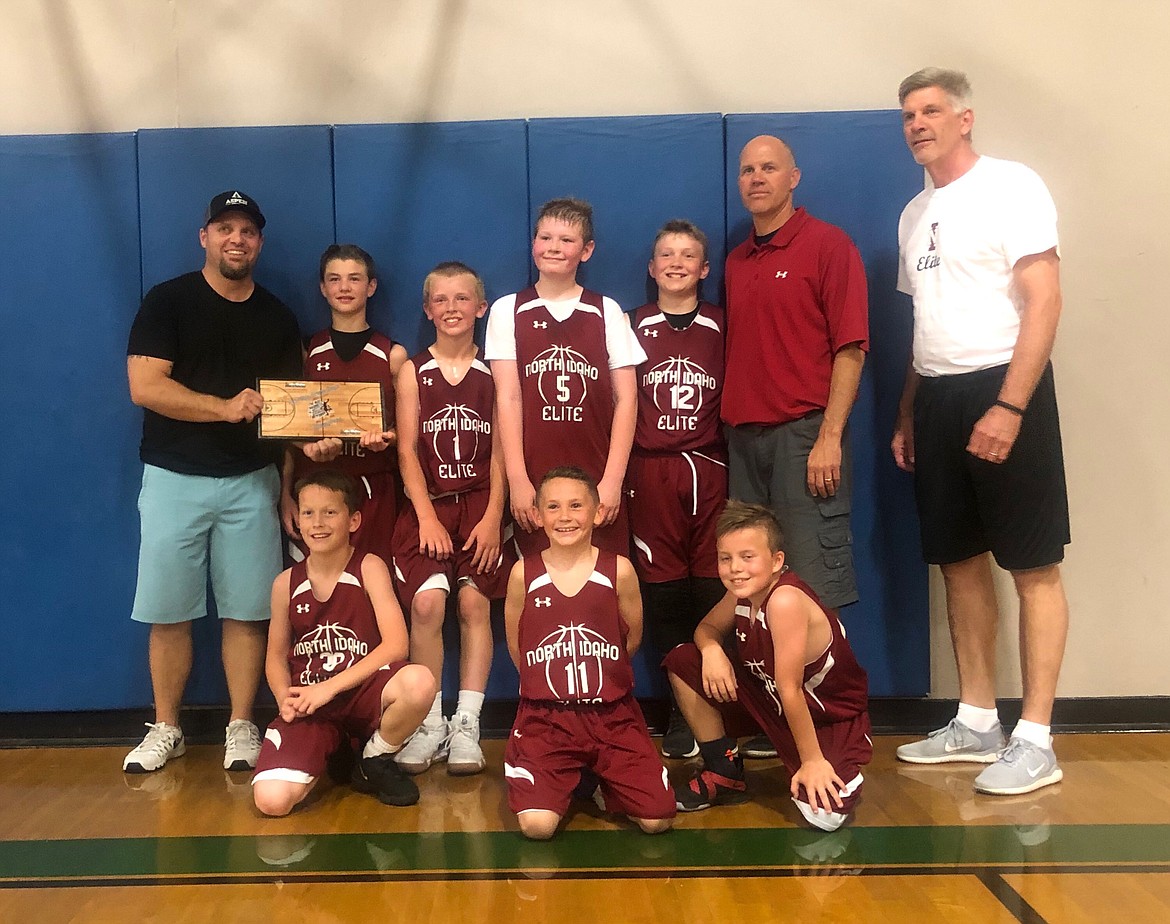 Courtesy photo
North Idaho Elite won the Warehouse May Madness 4th/5th-grade championship 37-35 in OT vs. Built-4-ball. In the front row from left are Ben Mcelvany, Brett Johnson and Maddox Lindquist; and back row from left, coach Mike Lindquist, Britton Johnston, Tanner Stern, Jordan Carlson, Jackson Hackett, coach Royce Johnston and coach Chris Carlson.