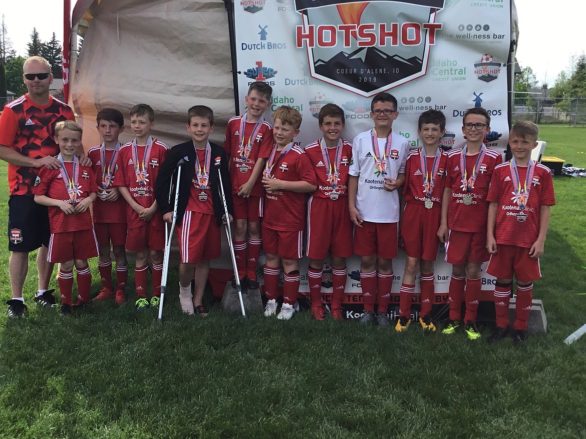 Courtesy photo
The Timbers North FC 09 Boys Yellow soccer team took second place at the Bill Eisenwinter Hot Shot Tournament last weekend. From left are coach Matt Frits, Luke Frits, Cole Thompson, Cooper Hermes, Archer Coburn, Cale Hanners, Luc Buckland, Grant Johnson, Ayden Cragun, Miles Hart, Sam Mandel and Blake Wise