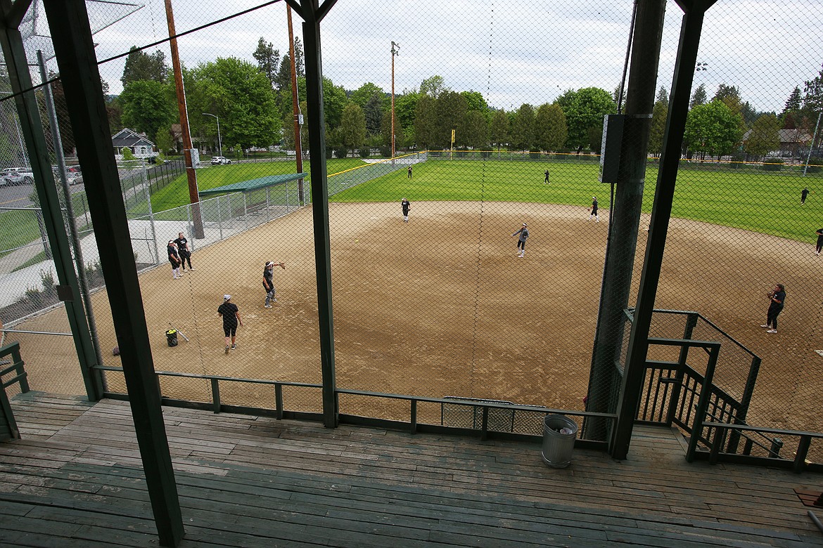 The North Idaho College softball team practices at Memorial Field on Tuesday. The refurbishing project for the Memorial Field grandstand includes locker rooms, concession and ticket areas and access for those with disabilities.