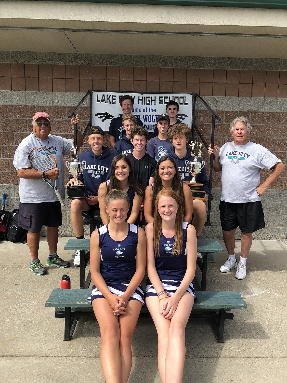 Courtesy photo
Lake City High won the overall team title at last week&#146;s 5A District 1-2 tennis tournament in Lewiston. Pictured are 11 of the 12 state qualifiers. Seated are, in the front row from left, Chloe Teets and Schreyer Jones; second row from left, Zannah Castaneda and Breanna Torres; third row from left, Jack DuCoeur, Gabe Gates and Leon Fleck; fourth row from left, Jacob Janzen and Paul Wineinger; and back row from left, Nick Brown and Daniel Olvera. Standing are Timberwolves boys coach Bob Brunn, left, and T-Wolf girls coach Roger Keilig. Not pictured is Kiki Cates.