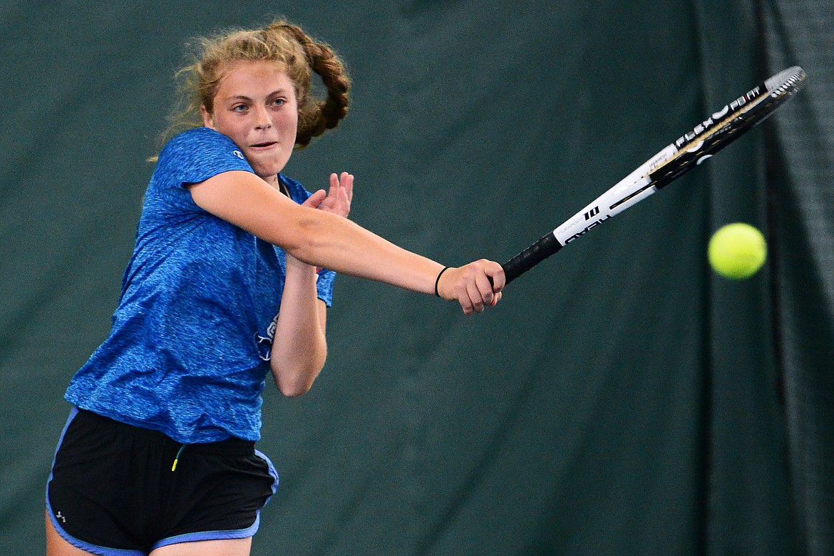 Columbia Falls' Hannah Schweikert hits a return against Whitefish's Gracie Smyley in the Northwestern A Divisional girls' singles championship at The Summit on Friday. (Casey Kreider/Daily Inter Lake)