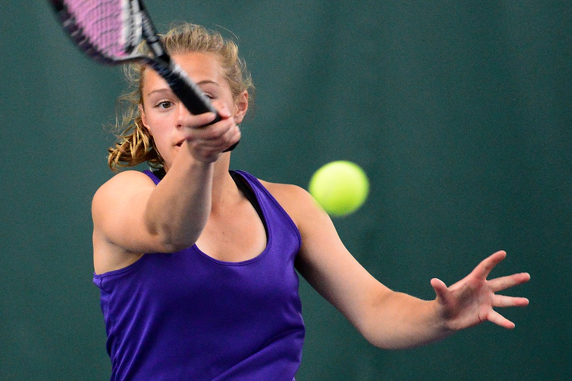 Polson's Berkley Ellis hits a return in the Northwestern A Divisional girls' doubles championship with teammate Qia Harlan against Whitefish's Olivia Potthoff and Aubrey Hanks at The Summit on Friday. (Casey Kreider/Daily Inter Lake)