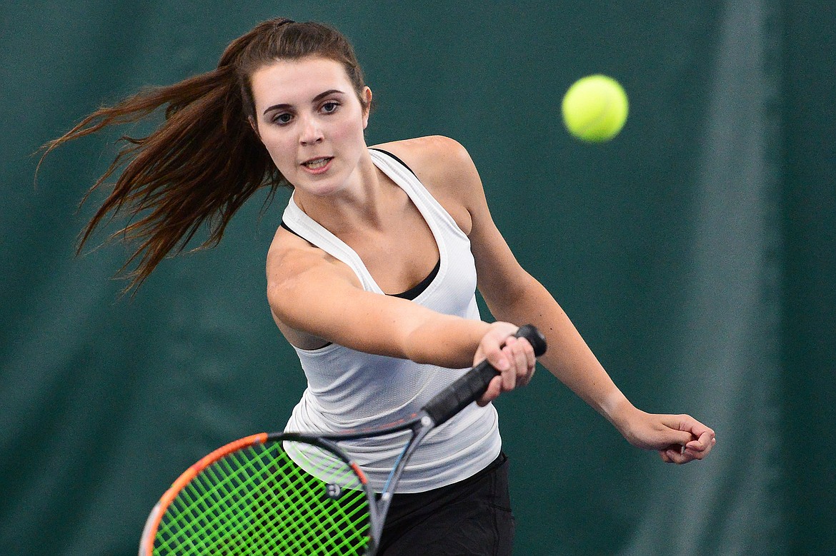 Whitefish's Olivia Potthoff hits a return in the Northwestern A Divisional girls' doubles championship with teammate Aubrey Hanks against Polson's Qia Harlan and Berkley Ellis at The Summit on Friday. (Casey Kreider/Daily Inter Lake)