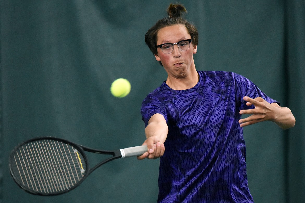 Polson's Joe McDonald hits a return against Whitefish's Brendan Buls in the Northwestern A Divisional boys' singles championship at The Summit on Friday. (Casey Kreider/Daily Inter Lake)